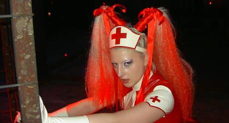 Rubber Tits photo collection featuring young woman in female domination fantasies